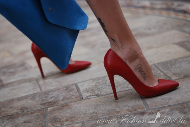 Red pumps and blue envelope clutch